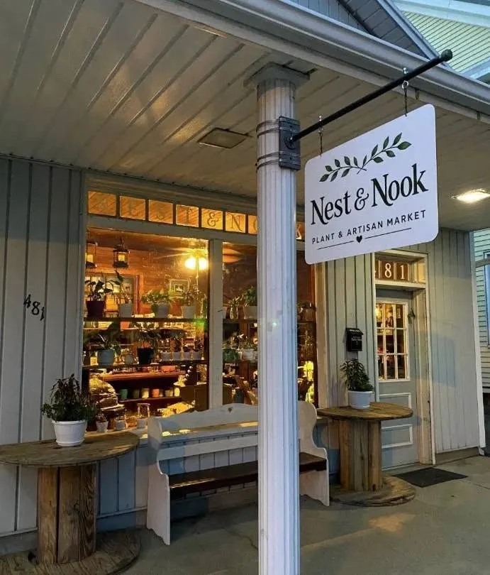 The Nest and Nook shop front, with its hanging sign